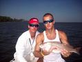 Josh and Captain Brant with a nice red caught in Santa Rosa Sound
